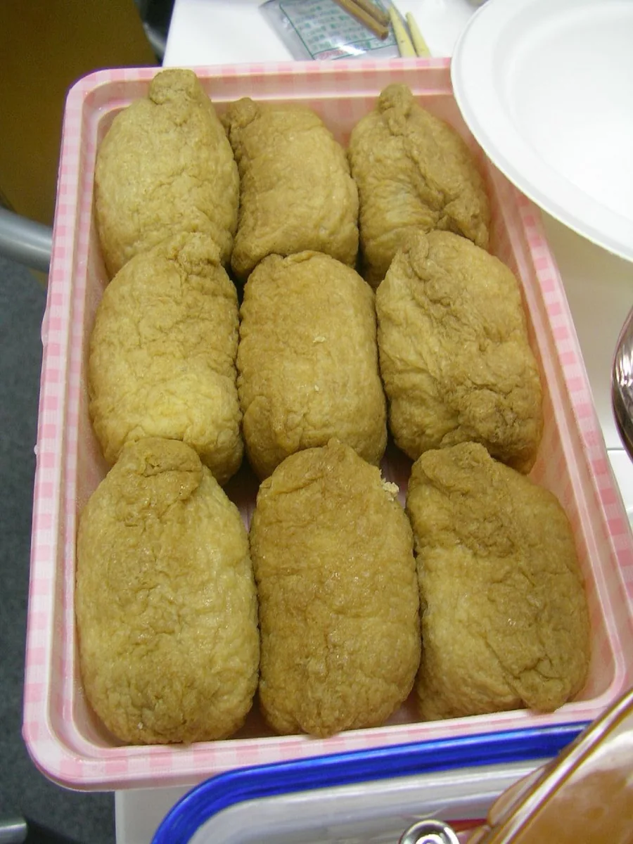 Inari sushi with rice tucked into golden fried-tofu pouches