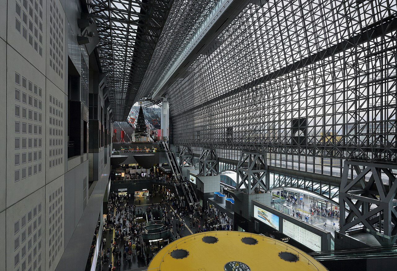 An elevated view along Kyoto Station’s central space, beneath a glass-and-steel roof