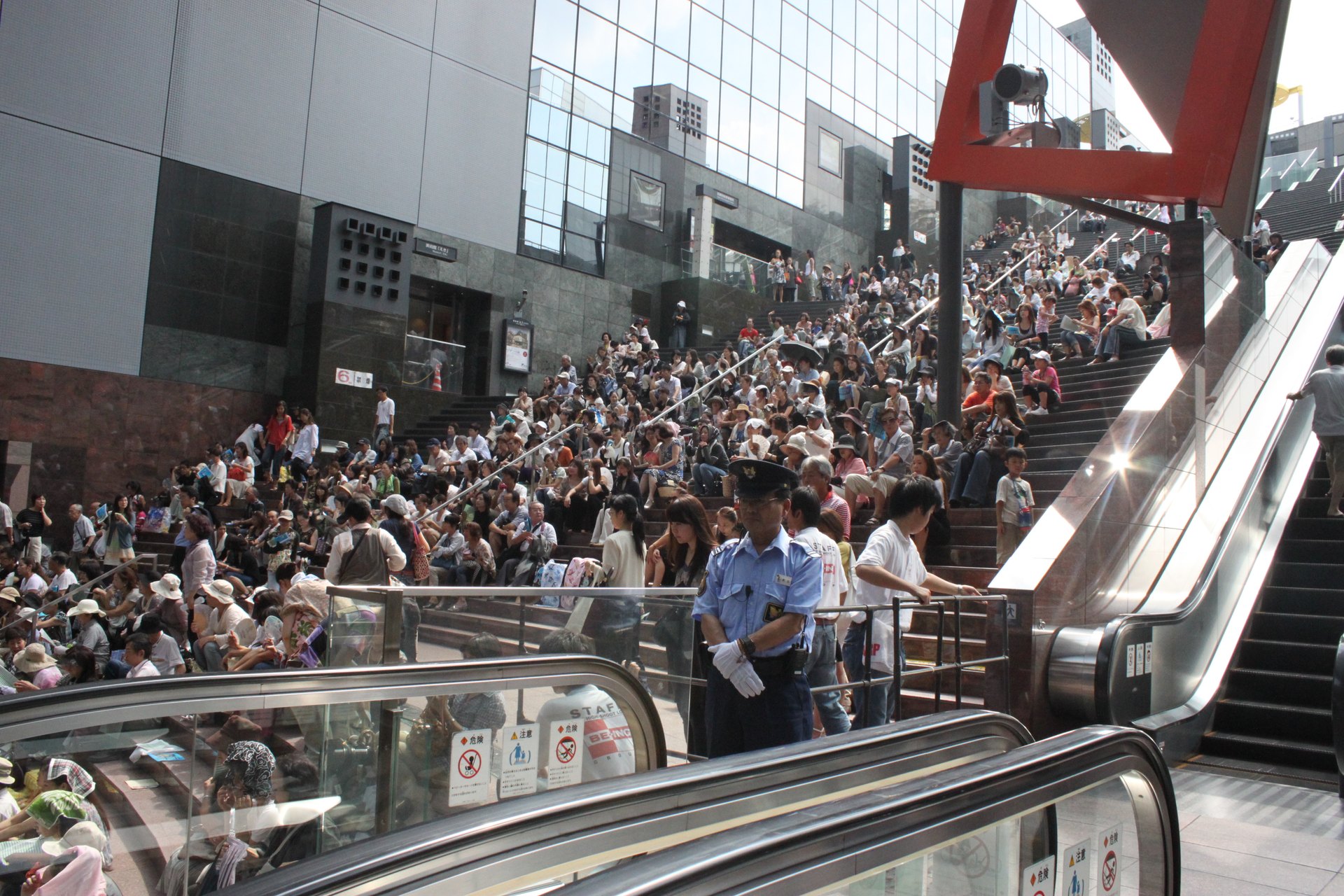 An audience seated on Kyoto Station’s broad Grand Staircase during an event in 2010