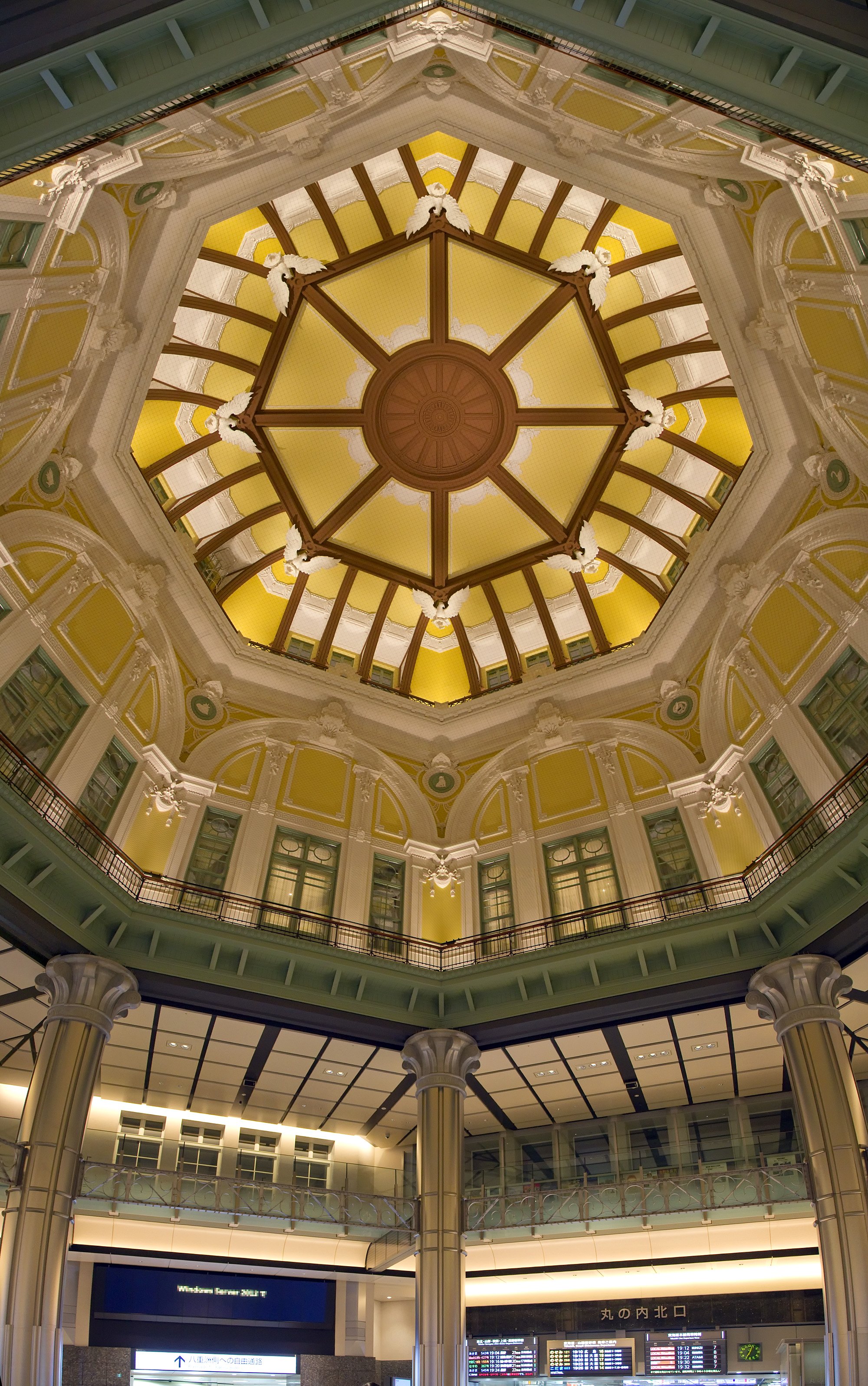 Tokyo Station dome, with eight white eagles and smaller animal reliefs in green panels