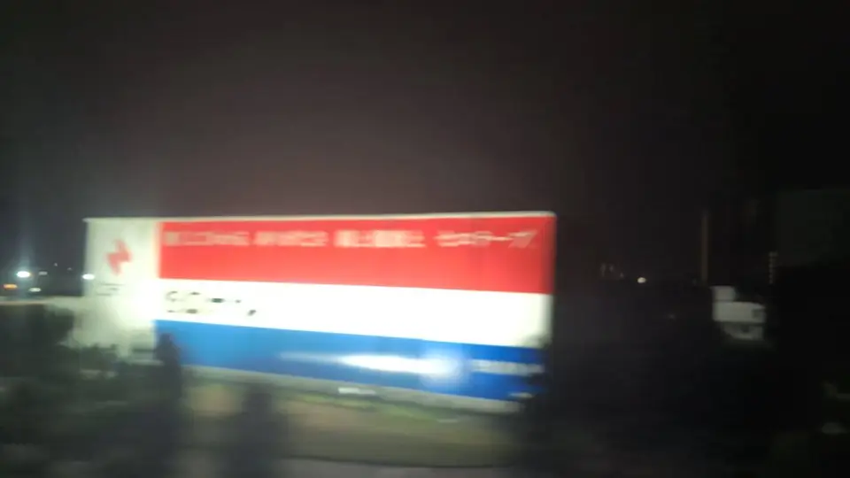The CELLOTAPE wall sign glowing at night