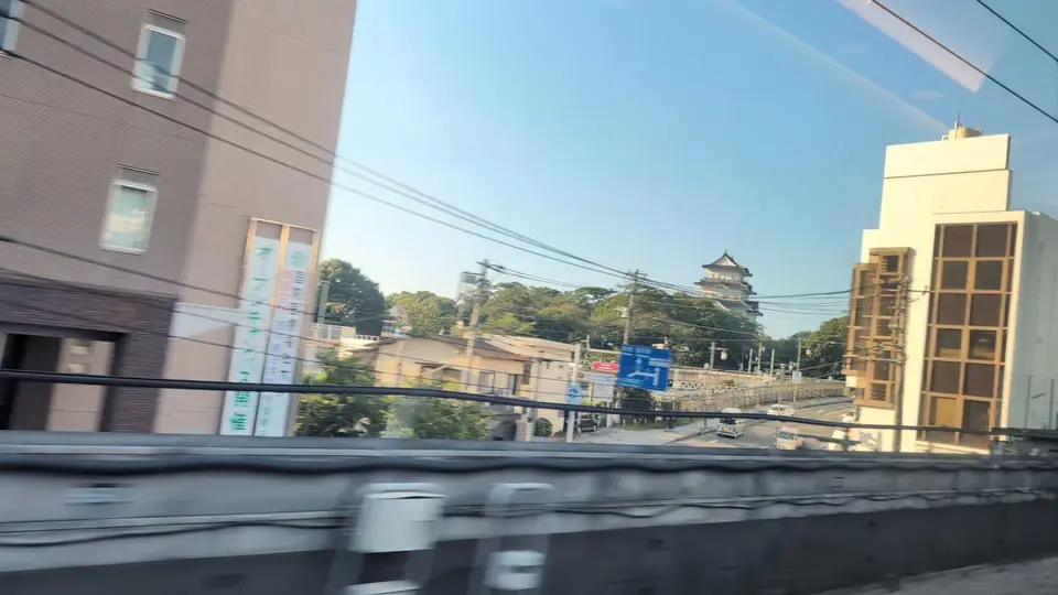 The keep of Odawara Castle beyond the townscape, from Seat A in the morning